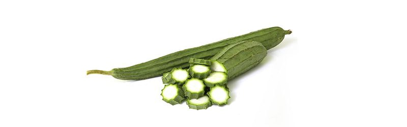 Ribbed Gourd against gray hair