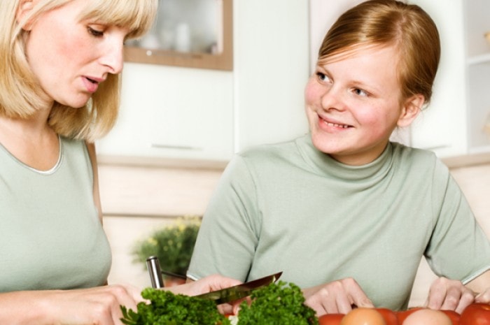 Mom and teen cook healthy